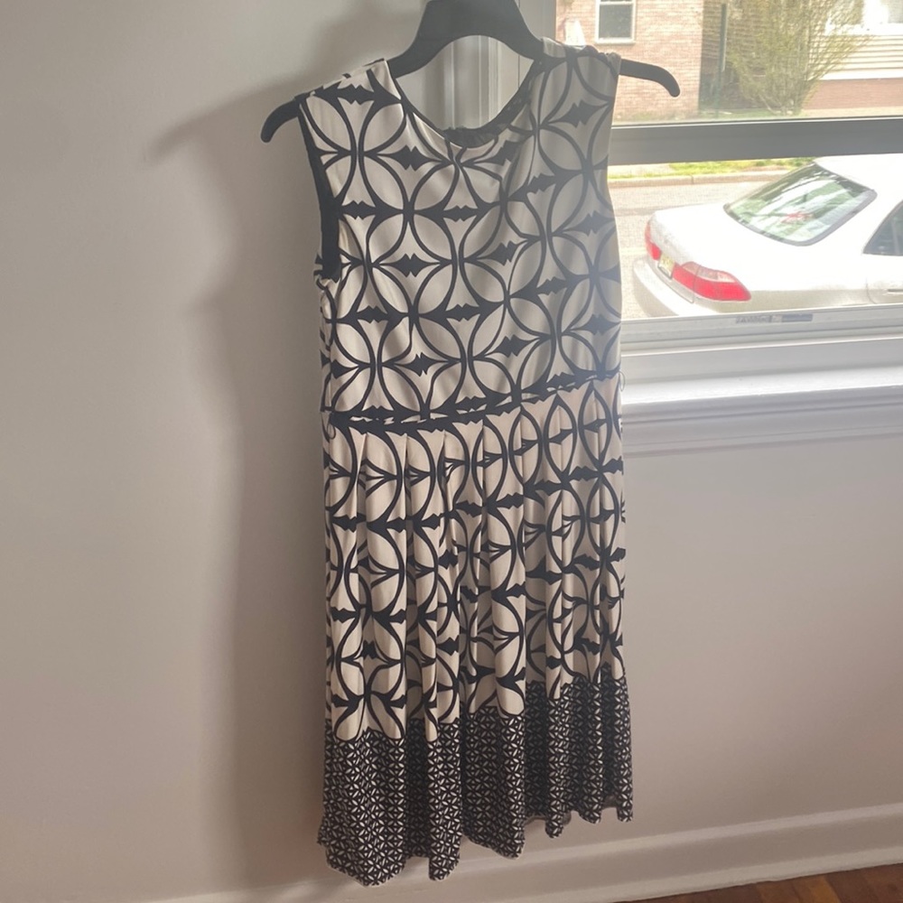 Navy blue and white, slightly worn dress. Comes with detachable belt.size: large